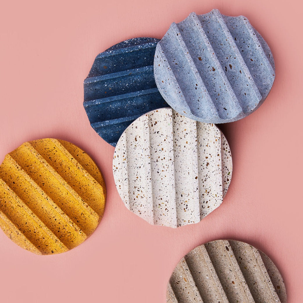 Terrazzo concrete small round soap dishes.