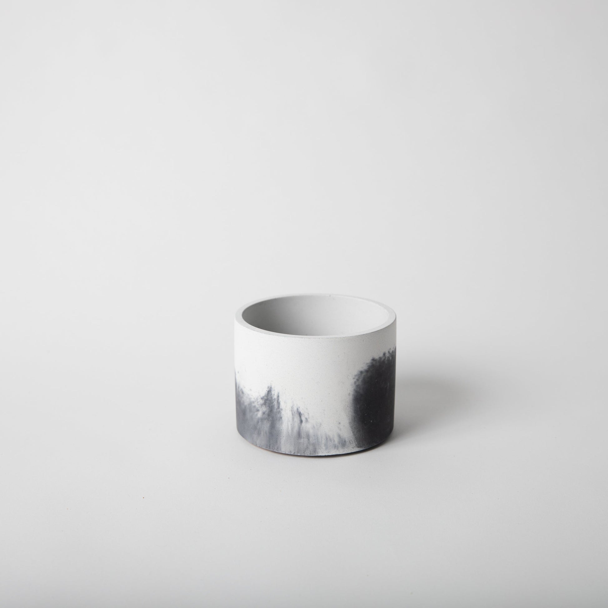 4 inch concrete vessel with cork base in black and white.