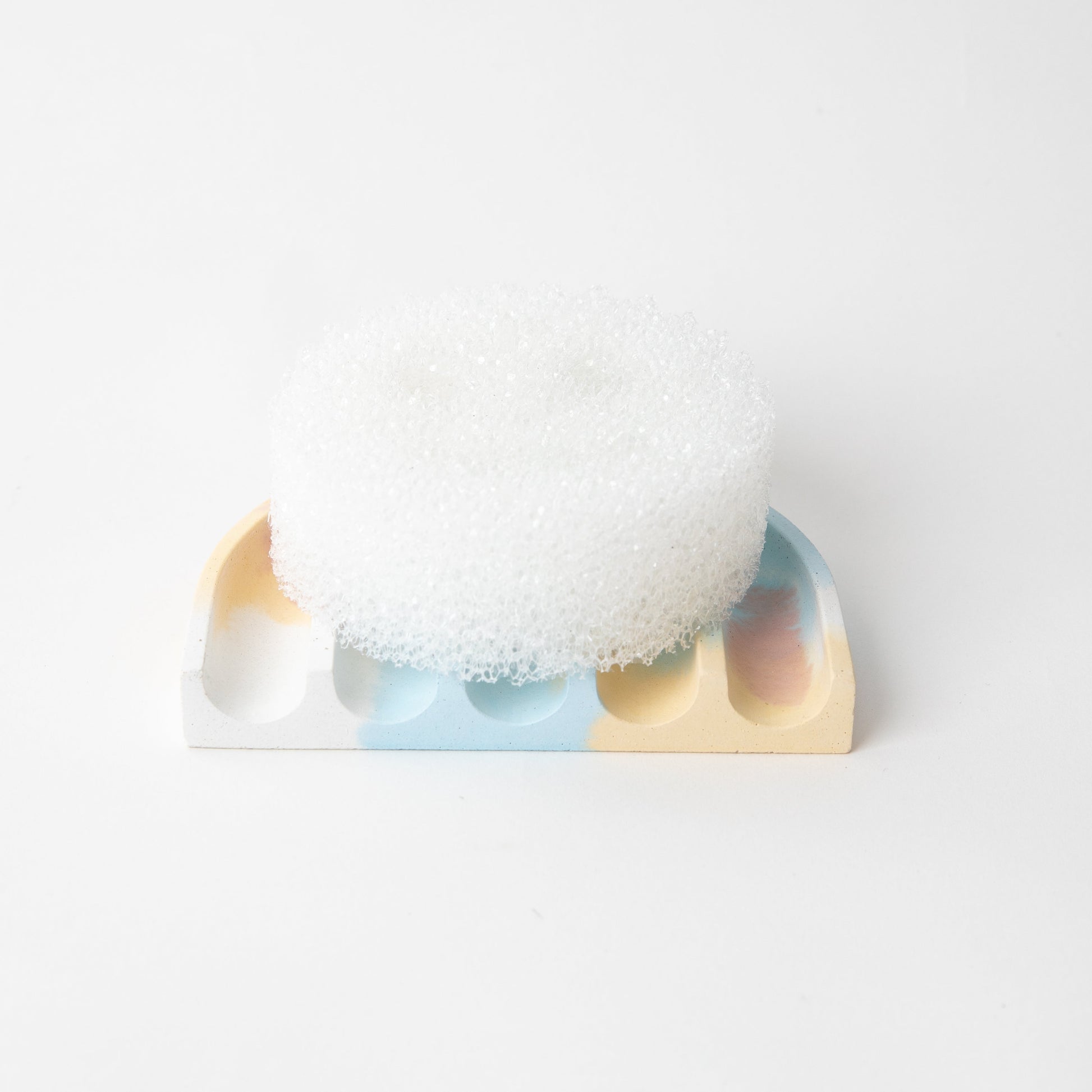 Concrete terrazzo sponge rest in jawbreaker with sponge.