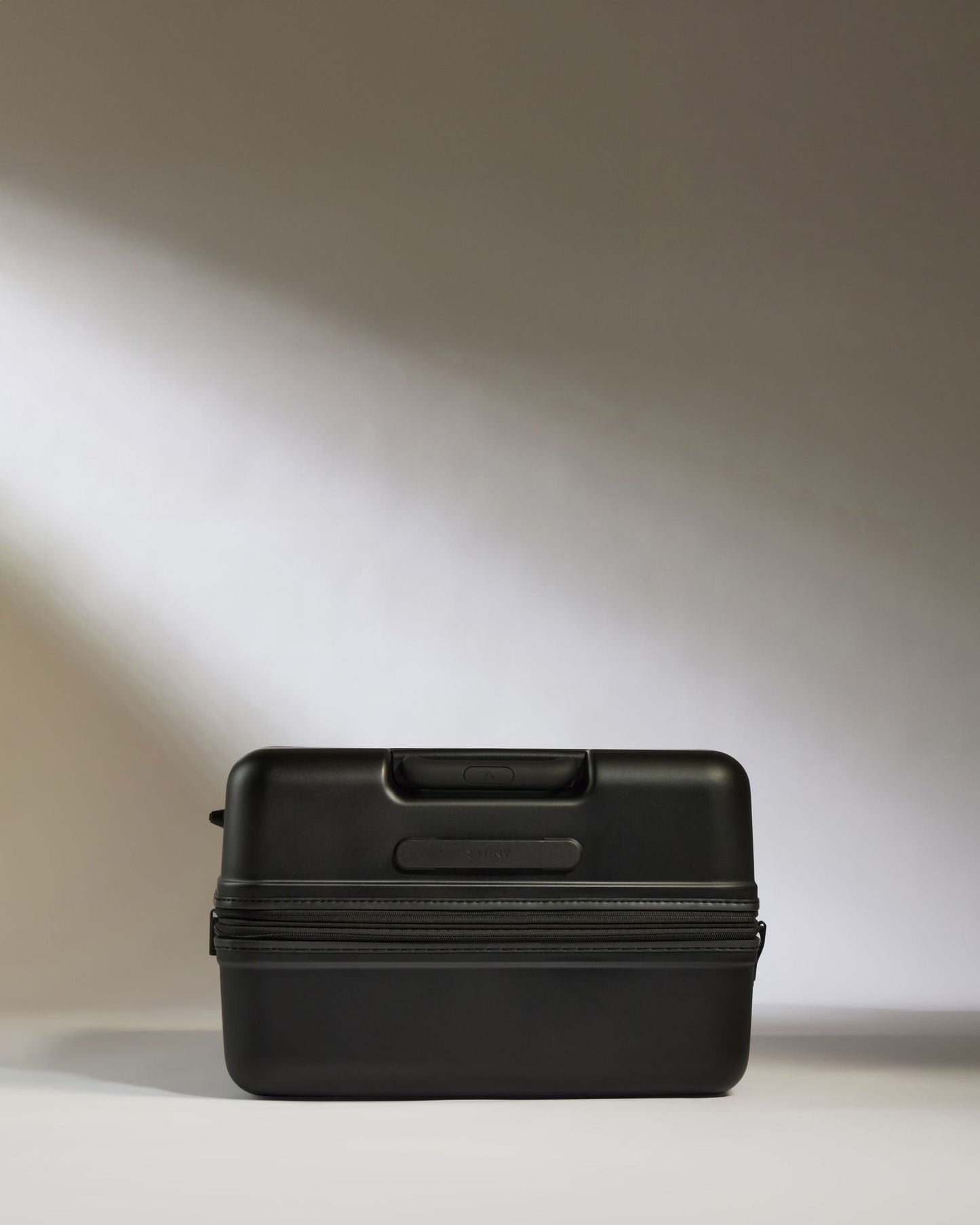 Large Luggage in Black - Icon Stripe