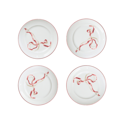A set of four ribbon dessert plates in pink. Harper’s Bazaar Best Hostess Gifts for Dinner Parties, Movie Nights, and More. These ribbon-adorned dinner plates can transform even an easy meal into something fit for a downtown It-girl. With three different colors to choose from, you can find the perfect option for home design lovers.