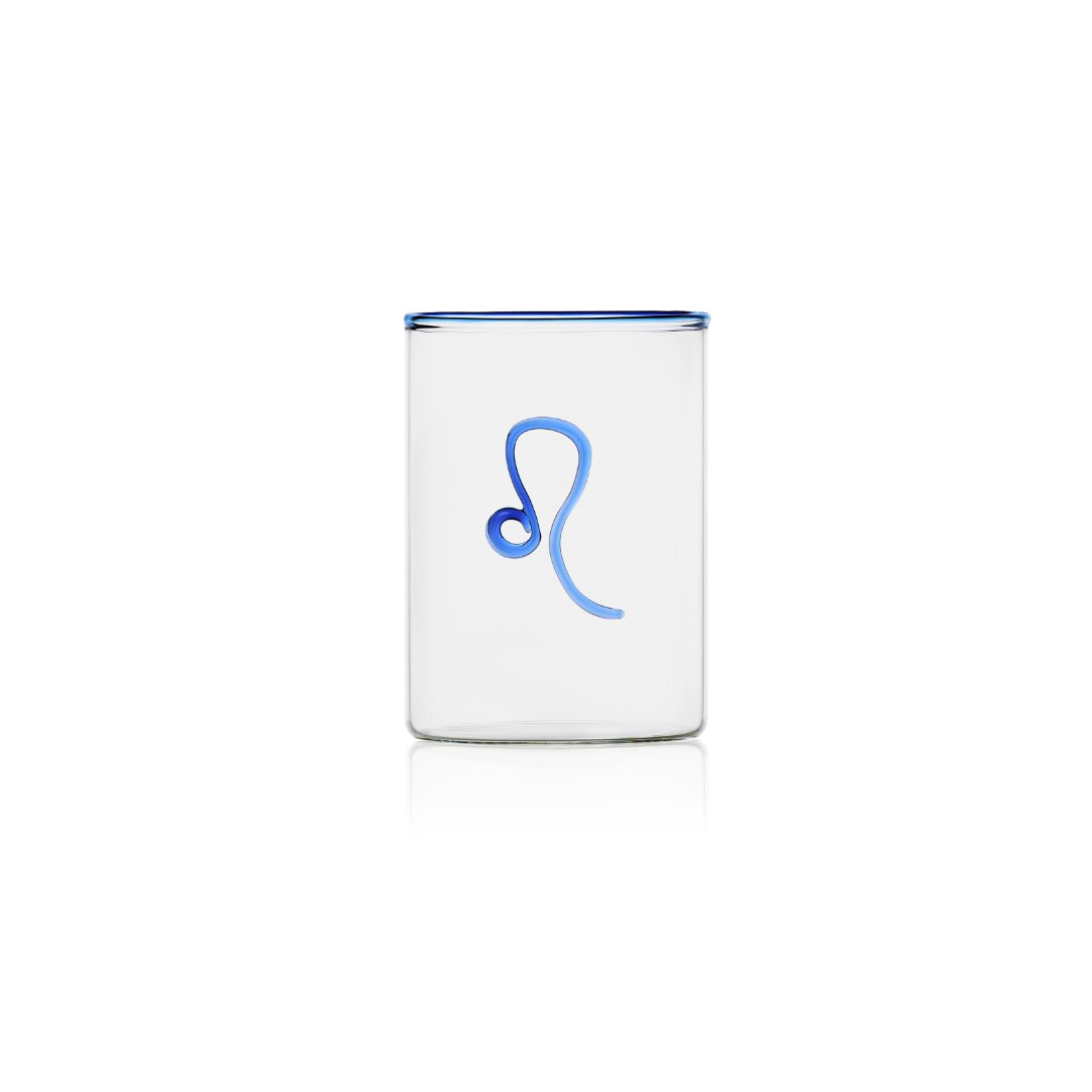 This handblown clear rocks glass with a Leo zodiac sign on the outside in cobalt blue glass brings just the right amount of color to the table. The Ultimate Gift under $50  Crafted of borosilicate glass, which is prized for its durability and resistance to thermal shock, this Zodiac Tumbler has a cobalt blue glass rim to add a cheerful yet elegant touch to any occasion.