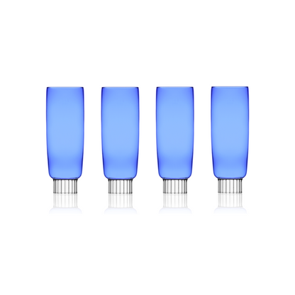 A set of four cobalt blue champagne flutes unique to Sprezz, designed for modern tables, perfect for adding a splash of color to New York chic Easter parties or spring gatherings.