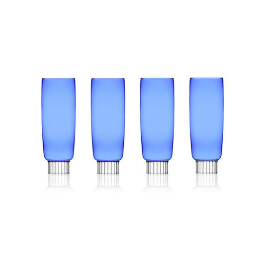 A set of four cobalt blue champagne flutes unique to Sprezz, designed for modern tables, perfect for adding a splash of color to New York chic Easter parties or spring gatherings.