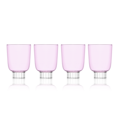 Set-of-four blush pink colored winery glasses. Sprezz's colored stemware and safe glassware are handmade and dishwasher safe, making them the perfect unique touch to any effortless dinner party.